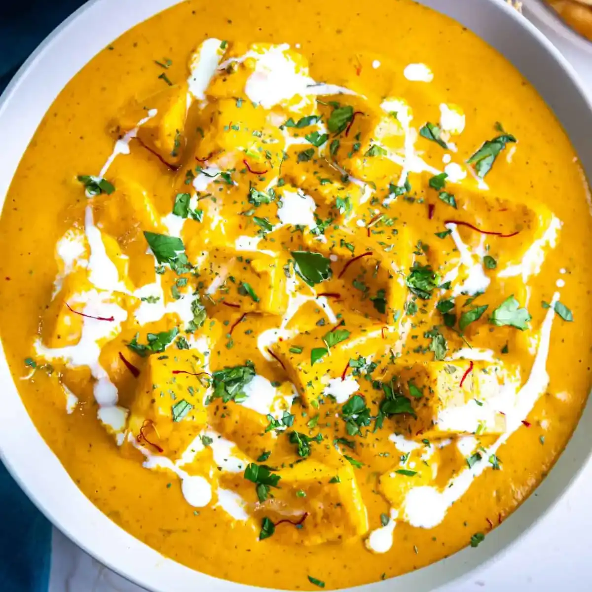 Shahi paneer — Indulge in tender paneer cubes bathed in a luxurious, golden cashew and at Aha Biryanis - Canton