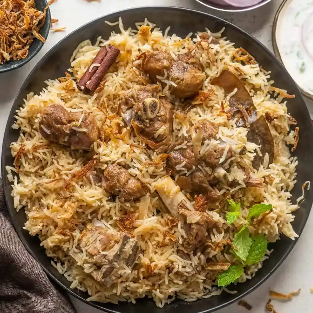 Goat pulav — Savor the rich flavors of tender goat meat simmered with aromatic at Aha Biryanis - Farmington hills, Farmington Hills