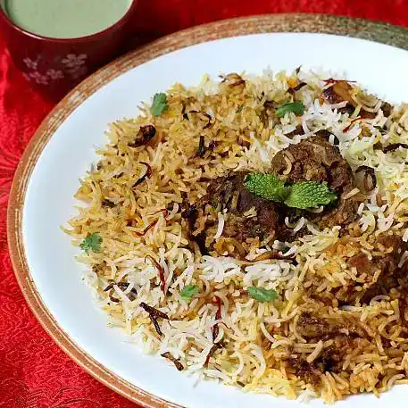 Goat dum biryani — Indulge in our Goat Dum Biryani: tender goat meat, aromatic basmati at Aha Biryanis - Farmington hills, Farmington Hills