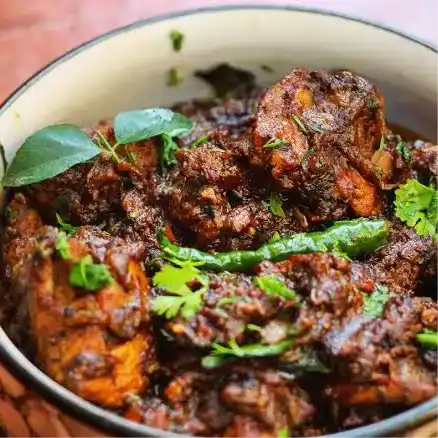 Pepper Chicken — Experience the bold kick of freshly ground black pepper coating at Aha Biryanis - Farmington hills, Farmington Hills