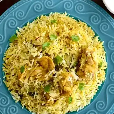 Mughlai Chicken Biryani — Experience the enchanting aroma of our Mutual Chicken Biryani, a at Aha Biryanis - Farmington hills, Farmington Hills