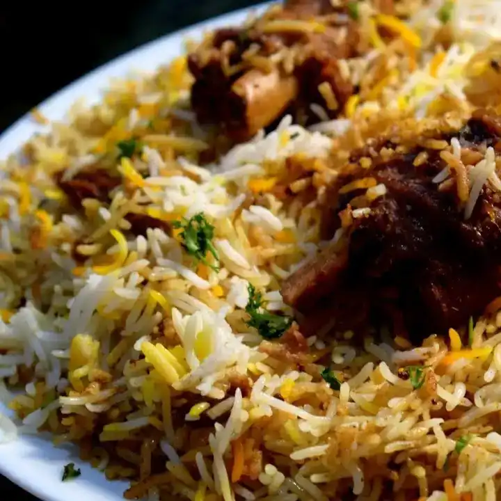 Mughlai Goat biryani — Savor the intoxicating aroma of our Mutual Goat Biryani, a masterpiece at Aha Biryanis - Farmington hills, Farmington Hills