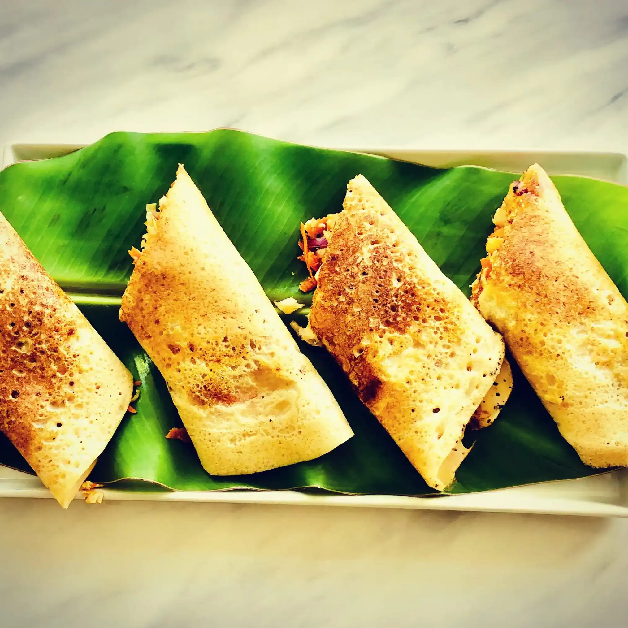 Spring Dosa — Experience the delicate crunch of a golden-brown dosa, perfectly at Aha Biryanis - Farmington hills, Farmington Hills