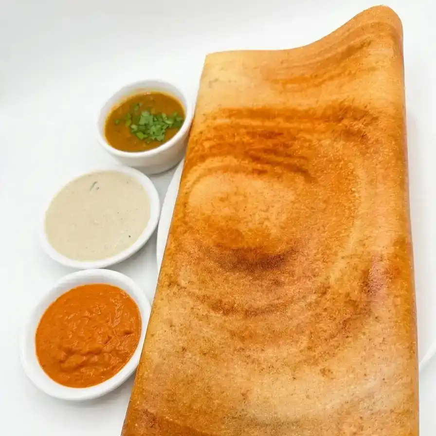 Paper Dosa — Enjoy a crisp, golden-brown Paper Dosa, expertly crafted to perfection at Konaseema Cuisine, North Brunswick