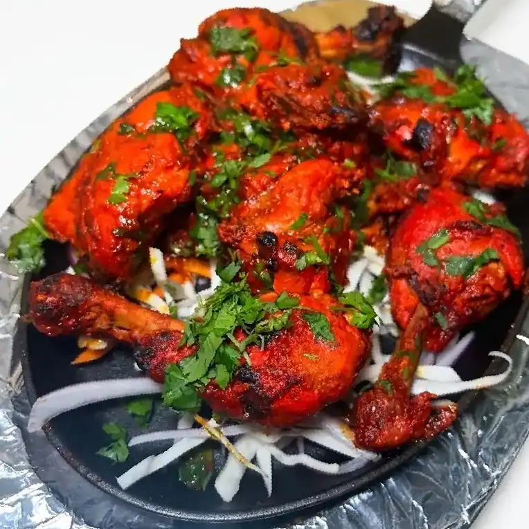 Tandoori Chicken Sizzler — Indulge in our Tandoori Chicken Sizzler: perfectly marinated chicken at Konaseema Cuisine, North Brunswick