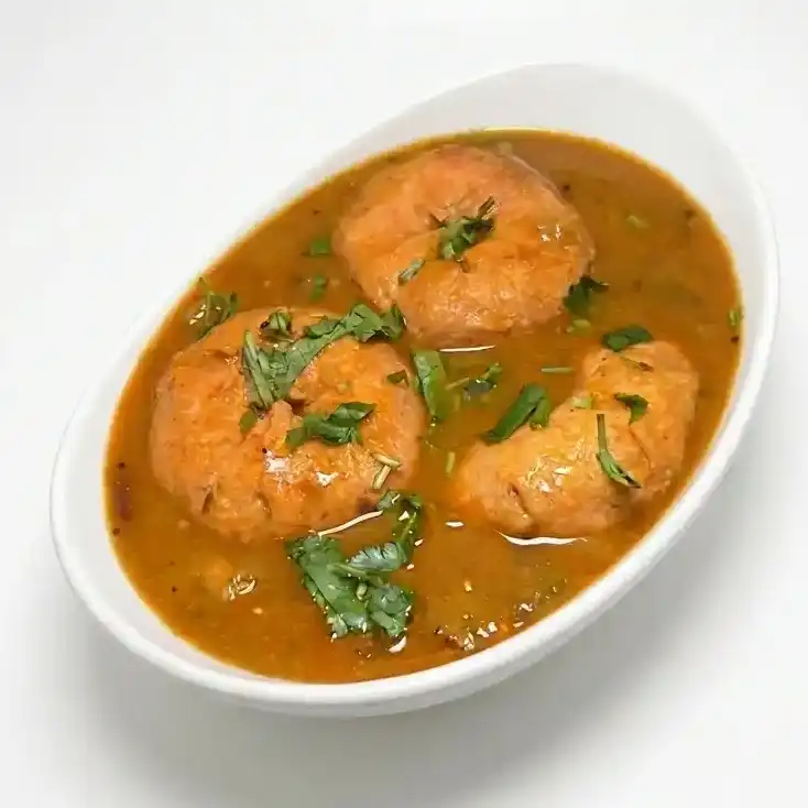 Sambar Wada - 2Pcs — Deep fried Lentil donuts soaked in sambar at Konaseema Cuisine, North Brunswick