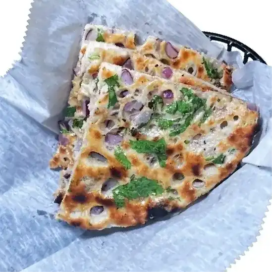 Onion Kulcha — Soft, fluffy Indian flatbread stuffed with spiced, caramelized onions at Konaseema Cuisine, North Brunswick