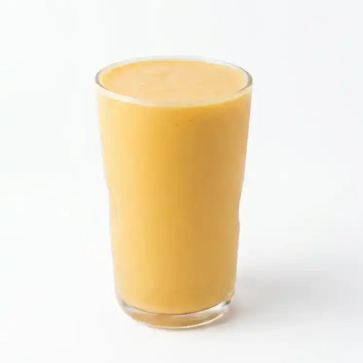 Mango Lassi — Experience the perfect blend of creamy yogurt and ripe mangoes in our at Konaseema Cuisine, North Brunswick