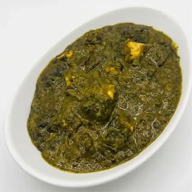 Palak Paneer — Savor the taste of India with creamy spinach and tender paneer cubes at Konaseema Cuisine, North Brunswick