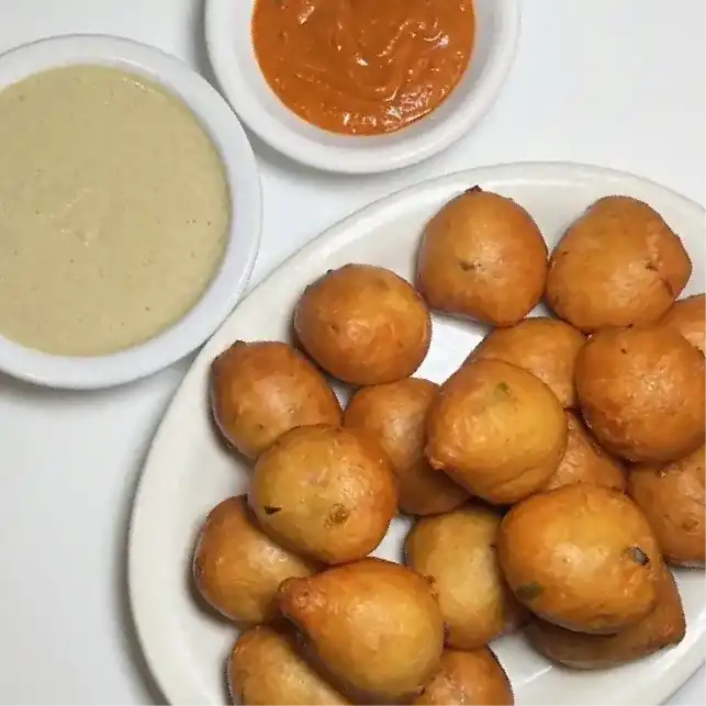 Mysore Bonda — Enjoy crispy, golden Mysore Bonda - deep-fried, savory lentil fritters at Konaseema Rocky Hill, Rocky Hill