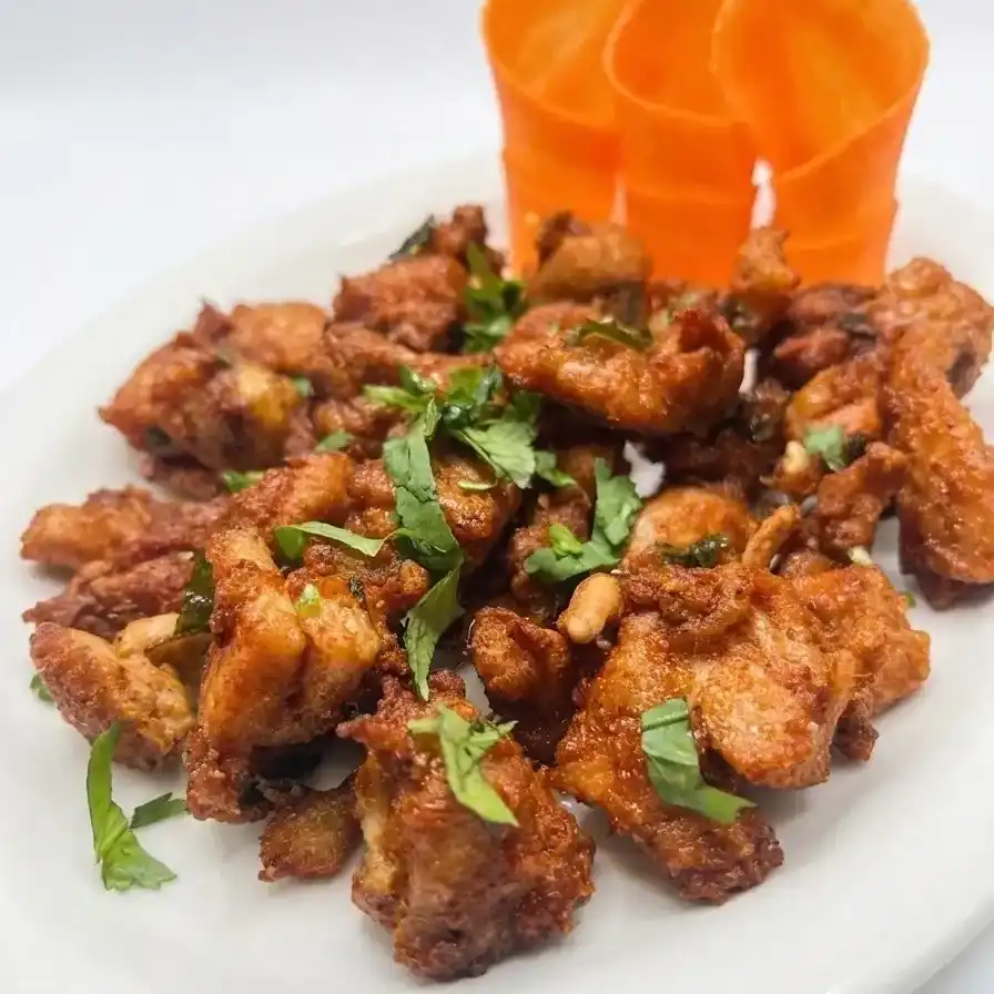 Kodi Pakodi — Delight in our flavorful Kodi Pakodi, a traditional Indian snack made at Konaseema Rocky Hill, Rocky Hill