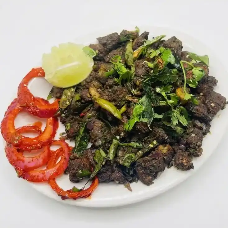 Pachimirchi Kodi Vepudu — is a traditional Andhra dish made from marinated chicken, pan-fried at Konaseema Rocky Hill, Rocky Hill