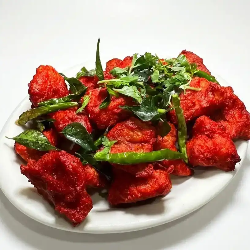 Fish 65 — Savor our Fish 65, a spicy, flavorful dish of fried fish chunks at Konaseema Rocky Hill, Rocky Hill