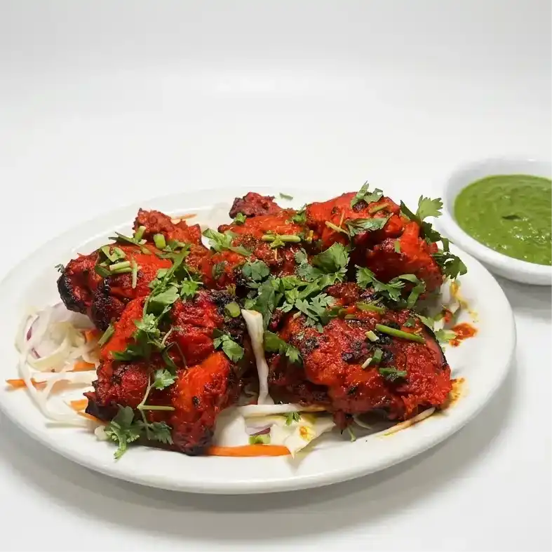 Tandoori Chicken Half — Savor the flavors of our succulent Tandoori Chicken Half, expertly at Konaseema Rocky Hill, Rocky Hill