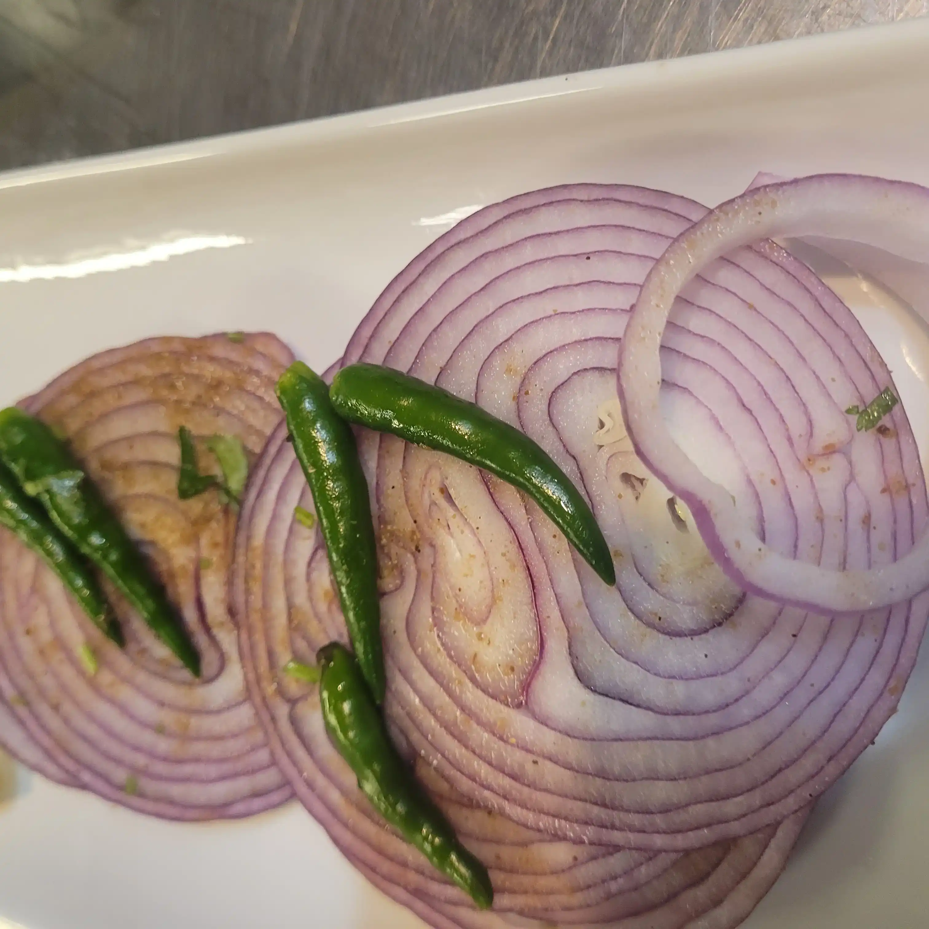 Sliced red Onion  Chilis  at Tulsi